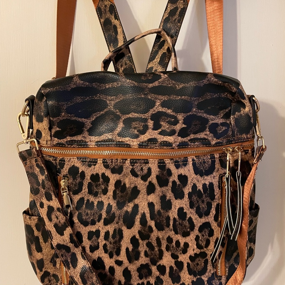 Animal print backpack with separate wristlet